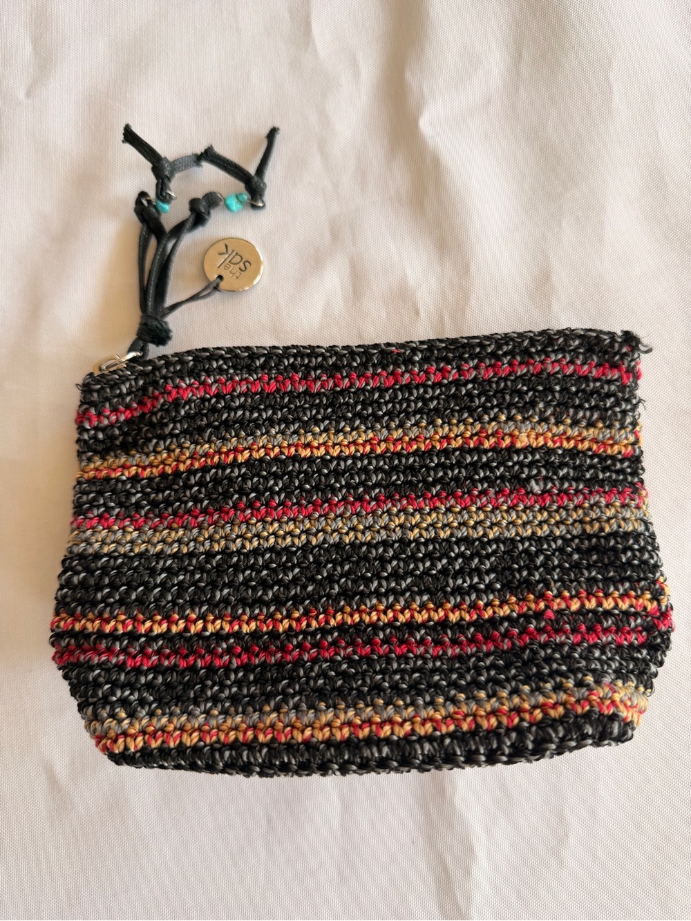 The Sak Multicolor Striped Crochet Woven Pouch with Tassel
